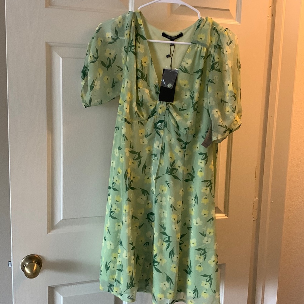 Little green sundresss. Small size with tag never worn.
